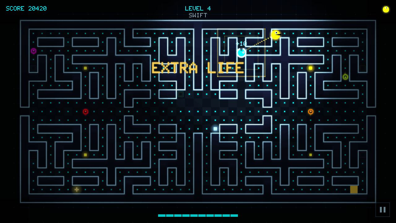 The 20,000-point moment: a gold EXTRA LIFE banner with a chomper comet flying the new life up to the HUD lives row